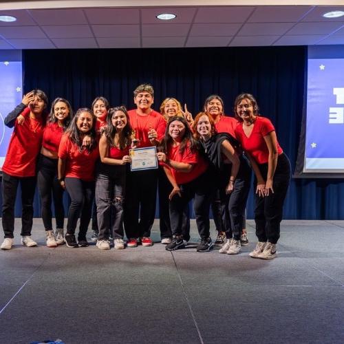 a group of students wearing red shirts after winning the lip sync battle